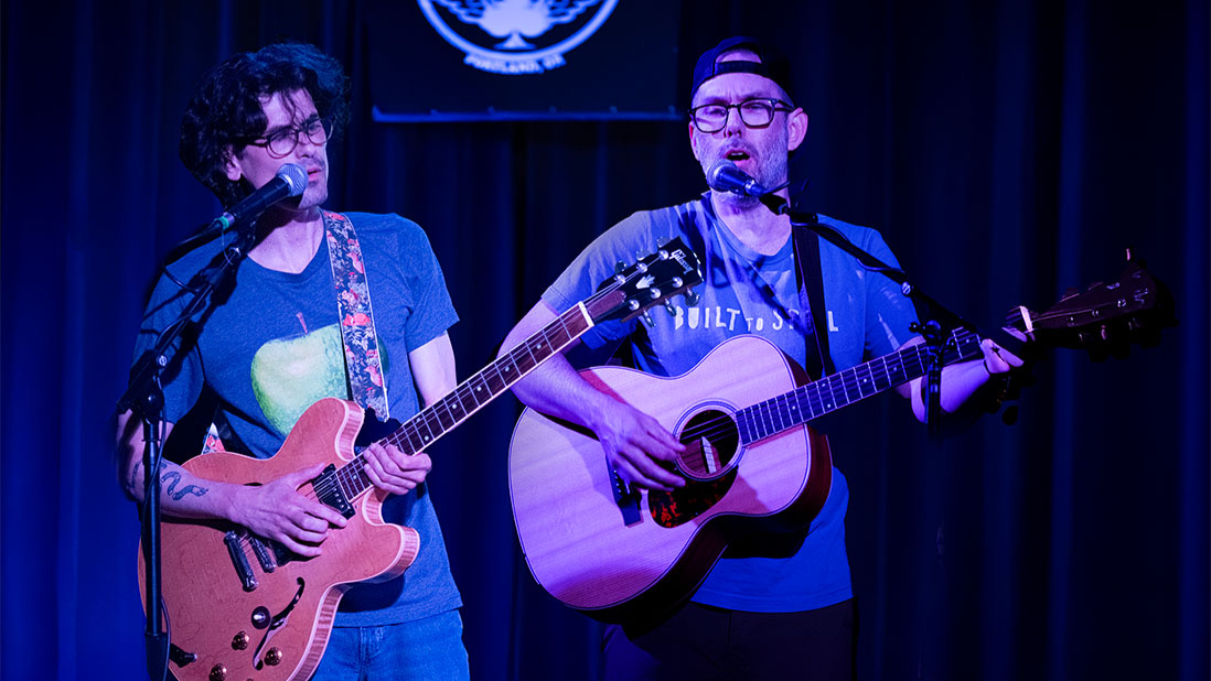 Victor Paredes & Rob Filitor
Musicians Victor Paredes and Rob Filitor, two-thirds of Portland-based Paper Mountain Band, offer an intimate acoustic performance shaped by rich harmonies and honest songwriting. Mixing folk, rock, and Americana influences, their sound is both familiar and fresh, marked by the easy interplay of voices that fit together like old friends.

JohnWan
John Wandschneider, known on stage as JohnWan, is a songwriter and guitarist from Portland, Oregon. His sound weaves classic blues roots with contemporary songwriting. Armed with acoustic, slide, and resonator guitars, he shapes songs rich in texture, soul, and truth. 

